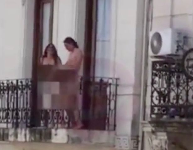 couple have sex on balcony