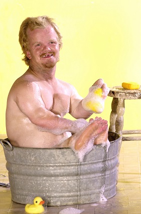 Dwarf washing himself in small bucket