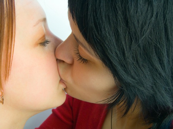 two women kiss