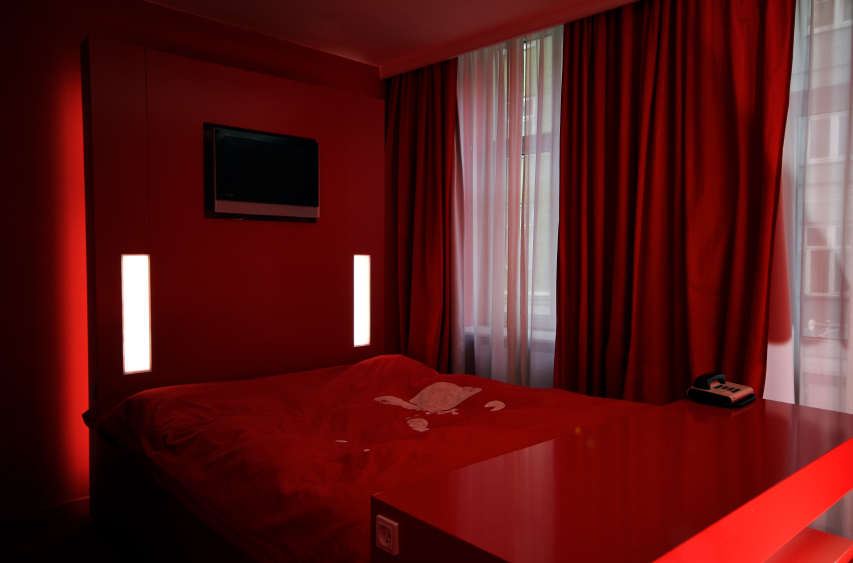 Red bed in a red room