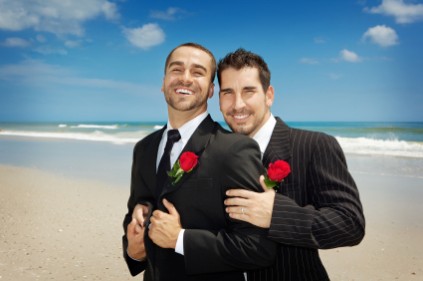 Two gay men in suits looking at the camera