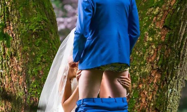 Couple Make Wedding Picture of Bride Giving Groom a Blowjob